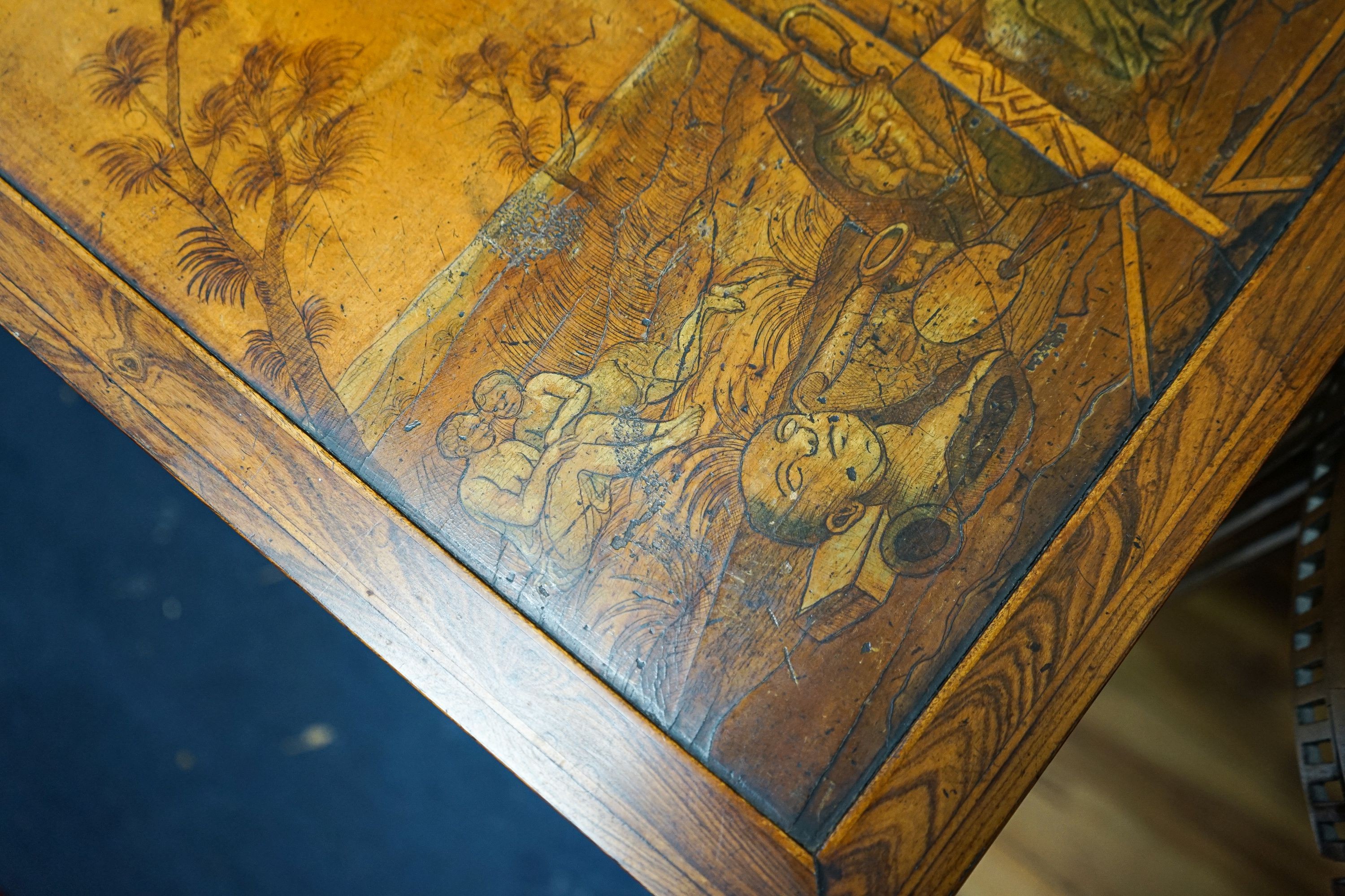 A 19th century Continental walnut side table, the top with penwork decoration and a tinted scene of figures among Roman ruins, width 41cm, depth 50cm, height 69cm